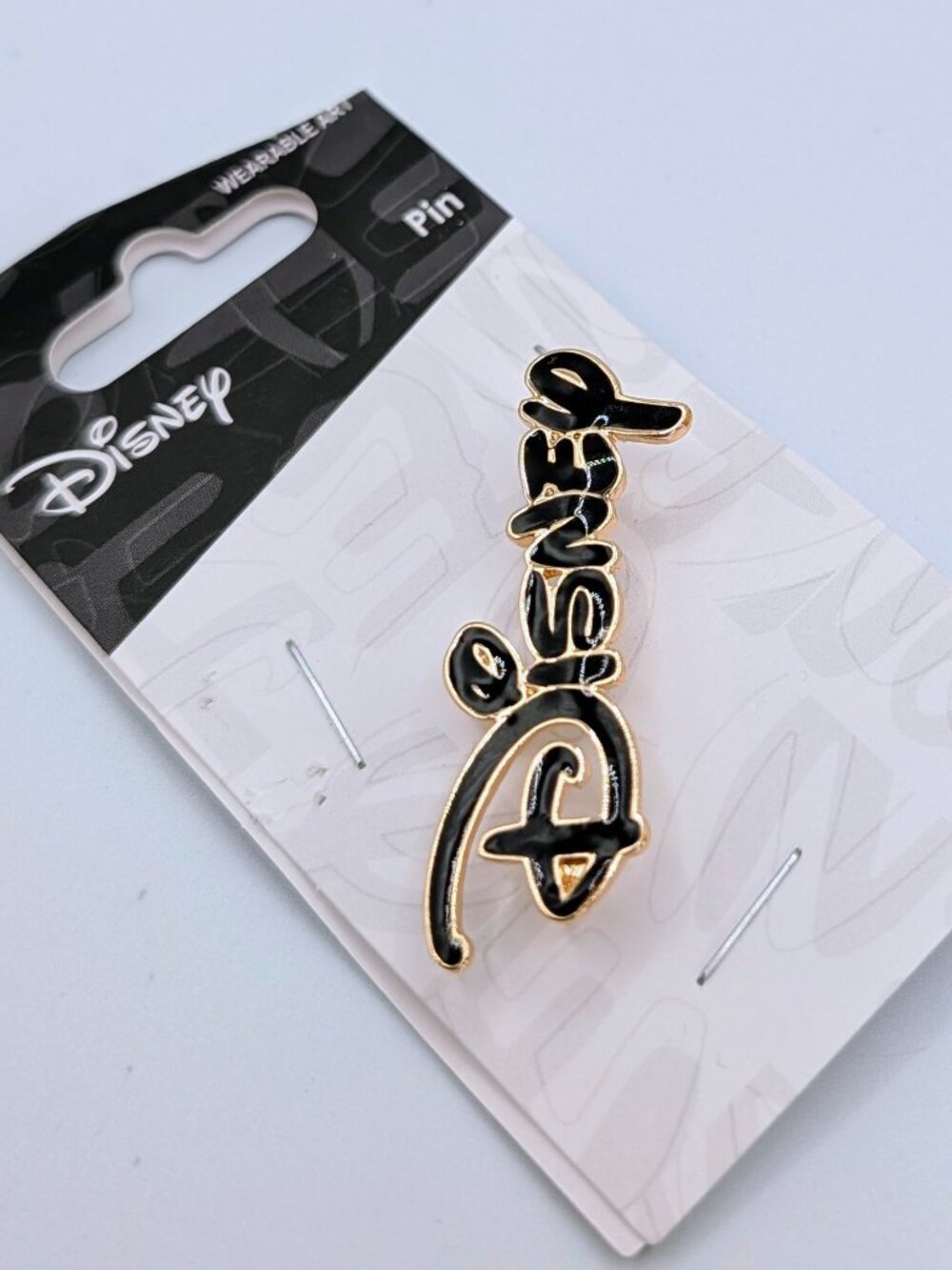 Disney Black and Gold Enamel Logo Pin - NWT